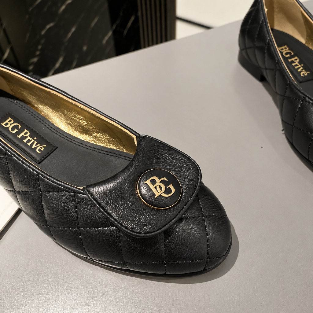 Black Quilted Leather Ballet Flats with Gold Medallions