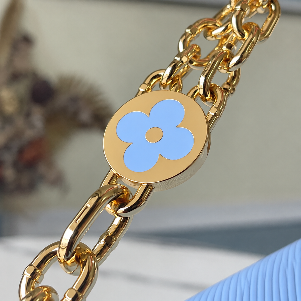 Twist MM in Bleu Nuage Epi Leather with Monogram Flower Chain